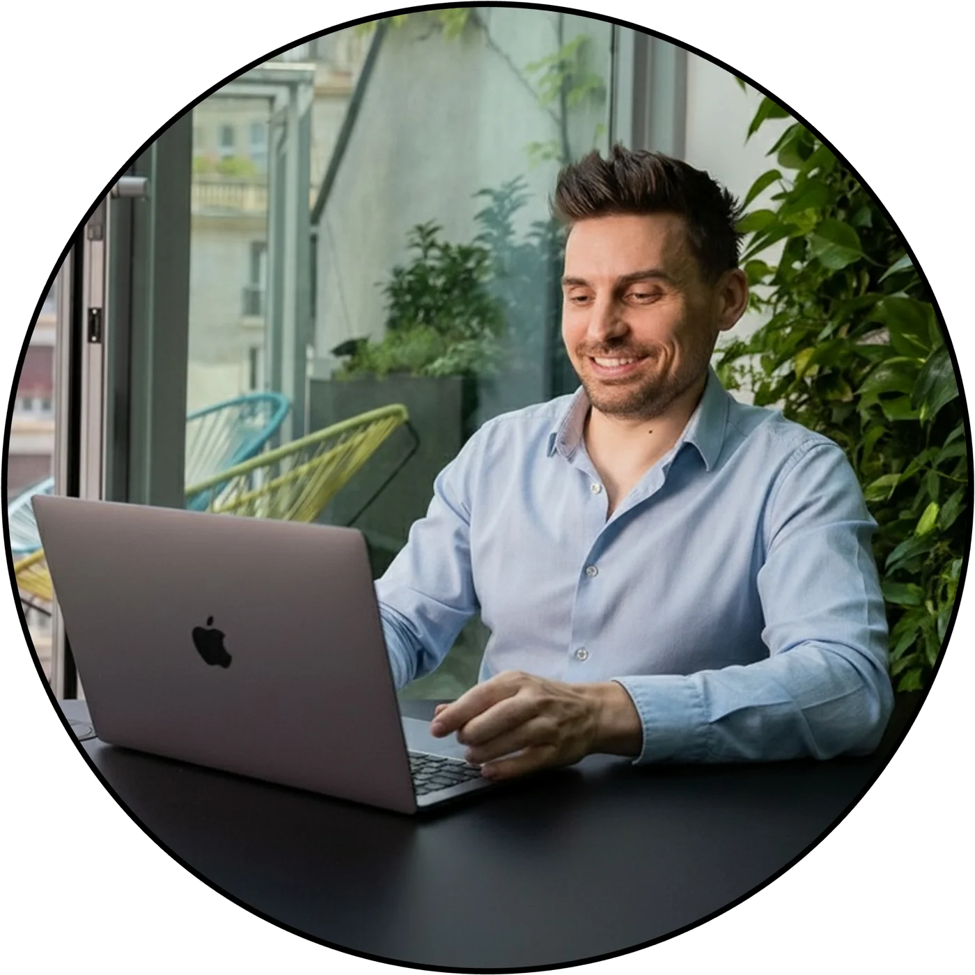 Matthew, 99fold's founder, working on a laptop